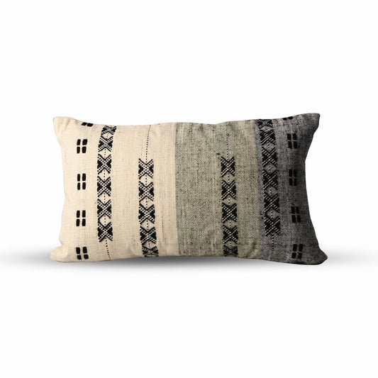 Handcrafted cotton and wool throw pillow in a stormy gray hue, 12x20 lumbar, featuring intricate woven details for a modern, minimalist touch.