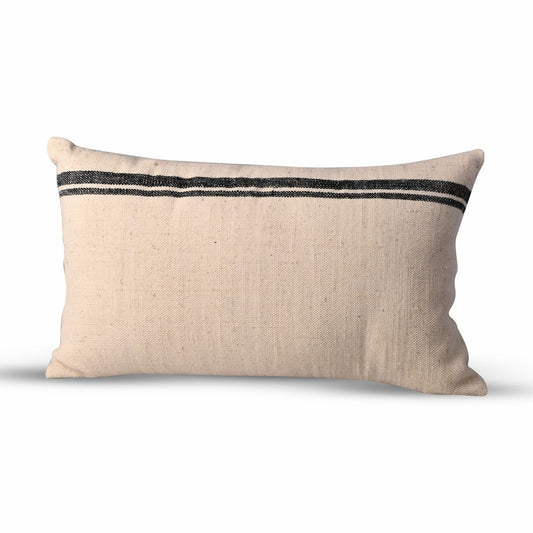 Minimalist solid-colored throw pillow, 12x20 lumbar, crafted from premium cotton and wool for a refined and timeless accent.